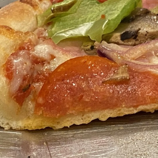 Mario McGees Pizza in Green Valley | Pizza slice close up